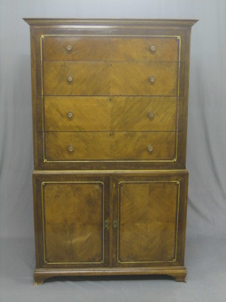 An Edwardian walnut tall boy, the upper section with moulded cornice fitted 3 drawers with tore handles, the base fitted a cupboard enclosed by panelled doors raised on bracket feet 38"