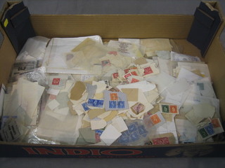 A shallow box of various stamps