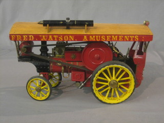 A metal and wooden model of a Showman's engine in the livery of Fred Watson Amusements 15"