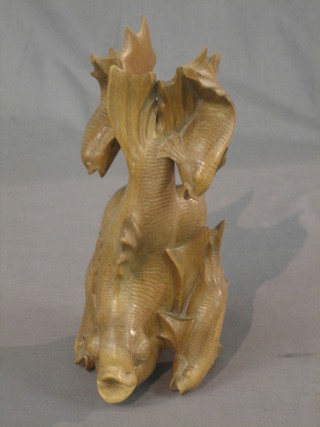 An Eastern carved figure of a diving carp 10"