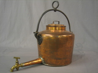 A 19th Century copper tea kettle with iron swing handle and copper and brass spigot