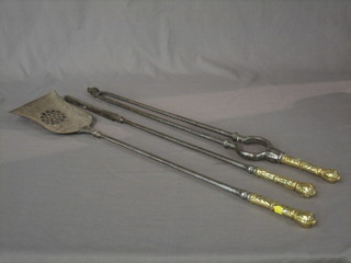 3 19th Century polished steel and brass fireside implements comprising shovel, poker and tongs