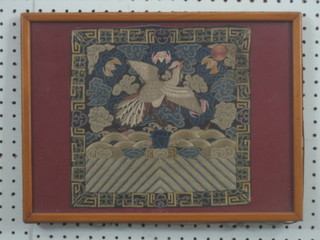 An Eastern fabric panel depicting a bird 10" x 10"