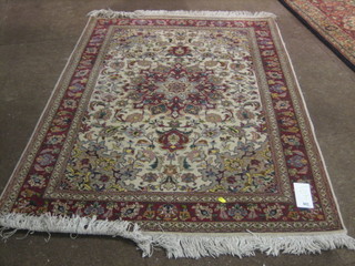 A contemporary fine quality white ground and floral patterned Persian rug 56" x 40"
