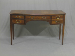 A Georgian style mahogany bow front side table with crossbanded top, fitted 1 long drawer flanked by 4 short drawers, raised on square tapering supports 51"