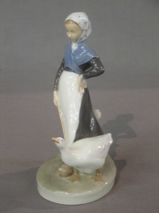 A Royal Copenhagen figure of a lady driving a goose, base marked 528 8"