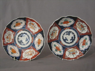 A pair of 19th Century Japanese Imari porcelain plates with lobed decoration 8"