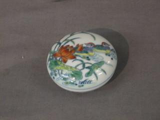 A circular Oriental porcelain jar and cover, the base with 6 character mark 2 1/2"