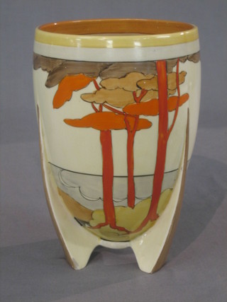 A Clarice Cliff circular vase decorated stylised trees, raised on 3 tapered supports, the base marked 452 Bizarre by Clarice Cliff 8"