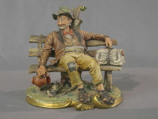 A Capo di Monte figure of a Tramp reclining on a park bench 10"