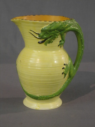 A 1930's Burley yellow glazed pottery jug, the handle in the form of a dragon 8"