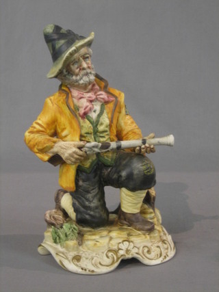 A Capo di Monte figure of a seated huntsman 12"
