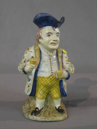 A Quimper Toby jug in the form of a standing Toby Philpot, base marked with an anchor 391579 France 11"