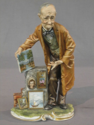 A Capo di Monte figure in the form of an Arts Salesman 9"