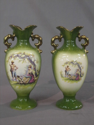 A pair of green glazed twin handled vases decorated romantic scenes 11"