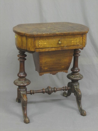 A Victorian oval inlaid figured walnut work table fitted a drawer with deep basket, raised on carved supports 28" (veneers bubbling, requires attention)