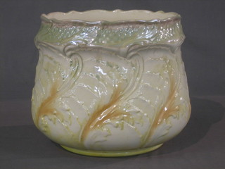 A circular green patterned jardiniere 8"