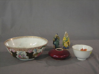 A circular Ox blood doughnut shaped vase 4", a porcelain teabowl decorated Carp 4", a Canton famille vert pedestal bowl 8" and 2 Oriental figures