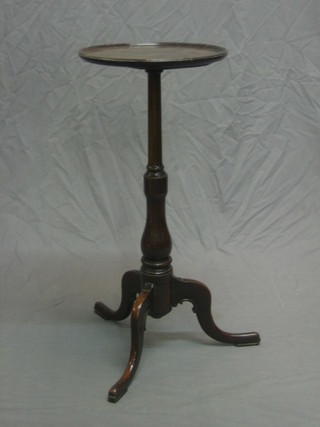 A 19th/20th Century circular mahogany wine table, raised on pillar and tripod supports 13"