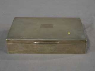 A rectangular silver cigarette box with engine turned decoration and hinged lid, Birmingham 1963, 6 1/2"