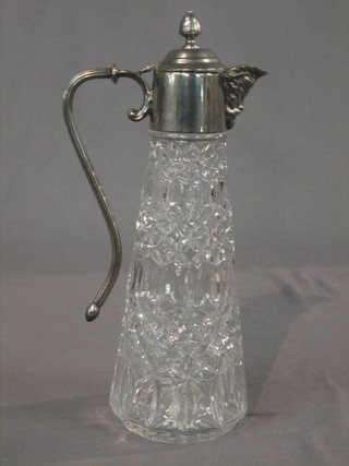 A moulded glass claret jug with plated mounts