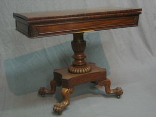 A William IV D shaped mahogany card table, raised on a turned column with triform base ending in paw feet 36"