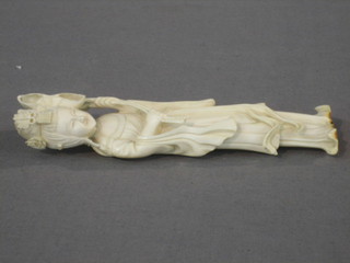 A carved ivory figure in the form of a standing lady 6"