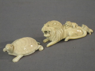 A carved ivory figure in the form of a lion 4" and a carved ivory figure of a turtle 2 1/2"