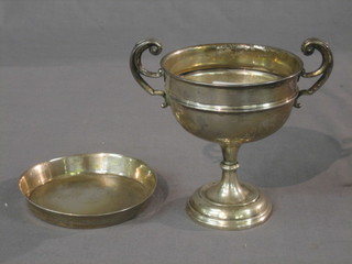 A silver twin handled trophy cup, Sheffield 1938 5" and a circular Eastern silver dish 6 ozs