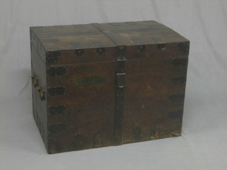 A Victorian oak and metal bound plate trunk with iron drop handles to the side, the interior marked Green & Ward Goldsmiths & Jewellers Cockspur Street 34"