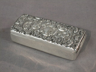 A Victorian rectangular silver tooth pick/collar bones box with embossed decorated hinged lid, the interior with glass liner, Birmingham 1880 3"