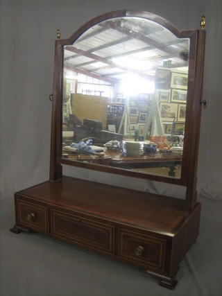 A 19th Century arch shaped plate dressing table mirror contained in a mahogany swing frame, the base fitted 1 long and 2 short drawers, raised on ogee bracket feet 24"