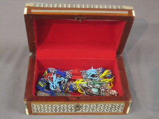 An Eastern arch shaped box containing a collection of various costume jewellery