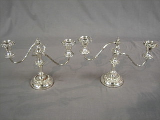A pair of silver plated twin light candelabrum