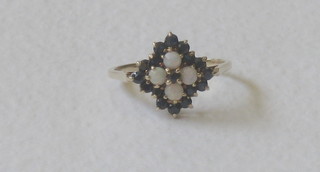 A lady's 9ct gold cluster dress ring set opals and sapphires