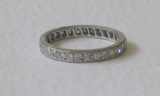 An 18ct white gold eternity ring set diamonds