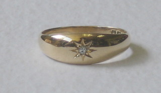 An 18ct yellow gold gypsy dress ring set a small diamond
