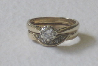 A lady's gold double dress ring set diamonds