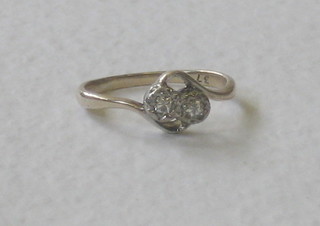 A lady's gold dress ring set 2 diamonds