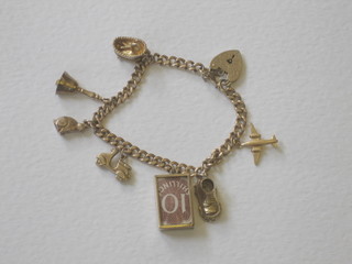 A 9ct gold curb link charm bracelet hung 7 various charms