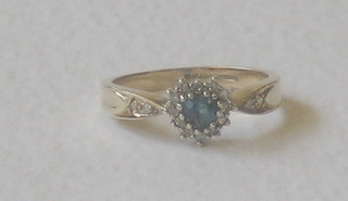 A lady's gold dress ring set a heart shaped topaz surrounded by a diamond