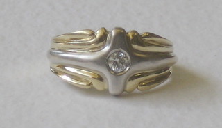 A heavy 9ct white and yellow gold dress ring set a diamond