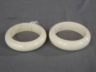A pair of turned ivory bangles