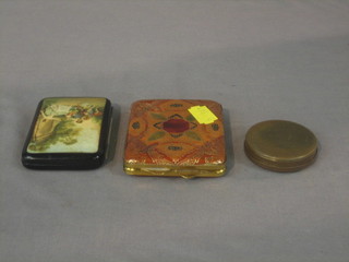 A circular pocket compass 2", a lady's lacquered cigarette case decorated a romantic scene, and a lady's leather compact