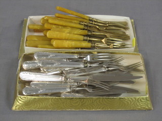 12 Continental silver handled fruit knives and forks and 1 other set of gilt bladed fruit knives and forks