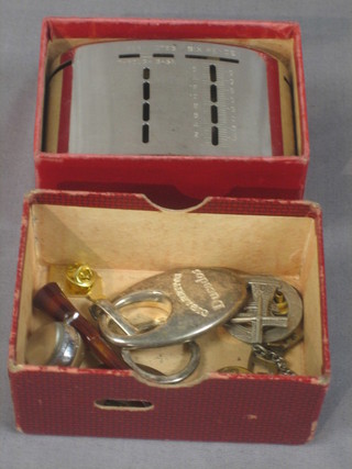 An oval metal Barclays Bank money box together with a small collection of various curios