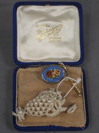 A gilt metal brooch, a seed pearl brooch, a fish shaped pendant and a micro mosaic brooch