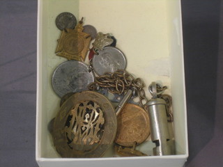 A whistle, a pierced gilt oval badge and a small collection of badges etc