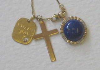 A gold chain together with 3 various gold pendants