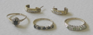 3 various gold dress rings and a pair of gold half hoop earrings set diamonds